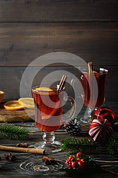 Warming Christmas drink with orange and cinnamon. Atmospheric shot of mulled wine