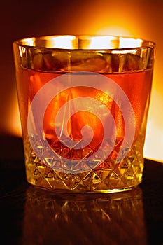 Warming fireside drink, backlit by the light of the fire