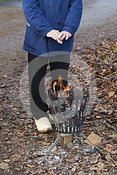 Warming hands on fire pit