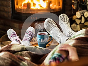 Warming and relaxing near fireplace.