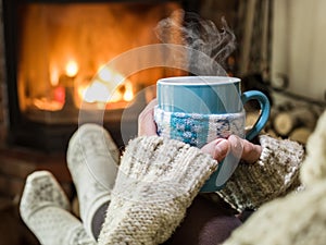 Warming and relaxing near fireplace.