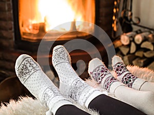 Warming and relaxing near fireplace.