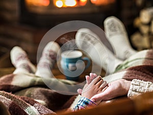 Warming and relaxing near fireplace.