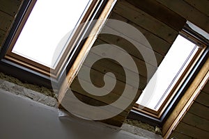 Warming and repair of attics at home. Montsard windows photo