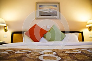 Warmly lit hotel room with shallow depth of field