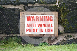 Warning anti vandal paint in use sign