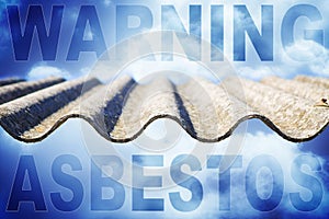 Warning asbestos: one of the most dangerous materials in the construction industry - concept image with a asbestos roof panel