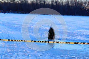 Warning or caution sign of drowning, frozen lake