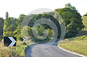 Warning chevron sign on sharp bend.