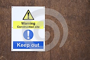 Warning construction building site sign keep out health and safety caution for workers and public people