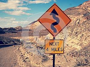 Warning curves sign in death valley panoramic road