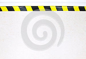 Warning hazard construction stripes sign or symbol texture isolated in granite concrete floor background, for safety first in lab.