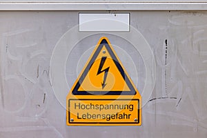 Warning high voltage sign, danger to life in German