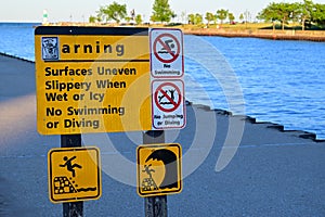 Warning No Swimming Or Diving Sign On Lake Michigan Lighthouse Pier