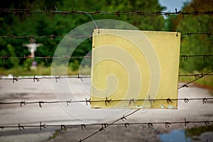 The warning plate on a barbed wire fence, Pripyat