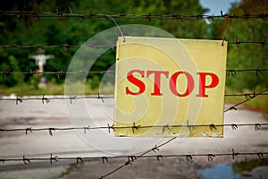 The warning plate on a barbed wire fence, Pripyat