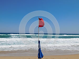 warning about the prohibition of swimming red flag on the beach. Cyprus. Ayia Napa.