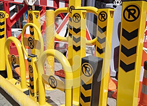 Warning and protective barriers for the vehicle park. They are yellow and black.