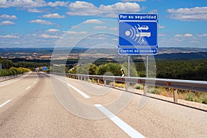 Warning radar sign in spanish highway.