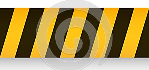 Warning ribbon with yellow black stripes. Barricade tape