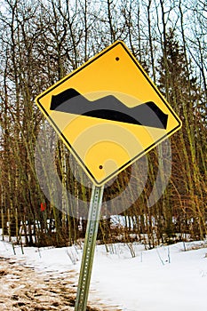 Warning rough road ahead sign