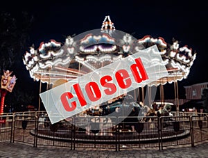 A warning sign that  the amusement parks are closed