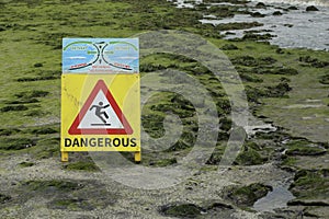 A warning sign on a breakwater