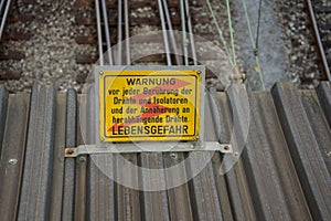 Warning sign Caution high voltage in german