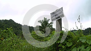 Warning sign cautioning against machinery