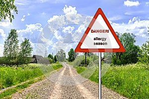 Warning sign: danger allergy season. warning sign: danger allergy season. rural landscape