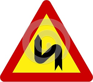 Warning sign with dangerous curves on left