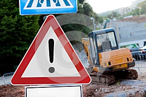 Warning Sign and Excavator