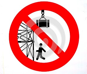 Warning sign. It is forbidden to pass or stand under the scaffolding. Stay out from under suspended loads.