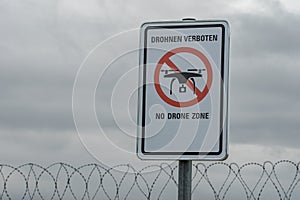 Warning sign at German airport fence `No Drone Zone`