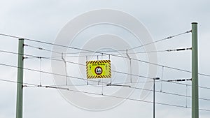 Warning sign for high voltage on an overhead line