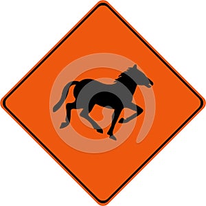 Warning sign with horses on road