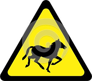 Warning sign with horses on road