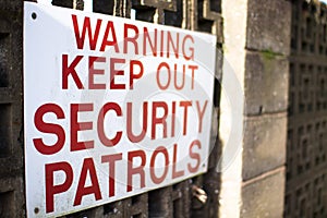 Warning sign, keep out, security patrols
