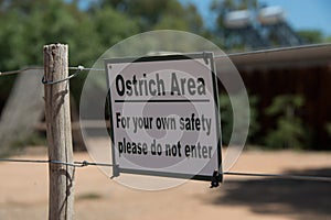 Warning sign on ostrich farm in oudtshoorn