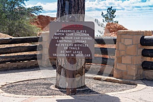 Warning sign posted at Bryce Canyon National Park informs tourist of dangers