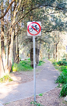 Warning sign at the public park walkway for Bicycles Prohibited.