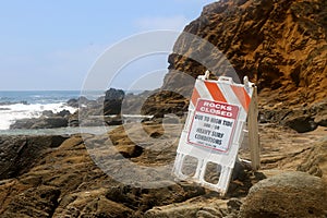 Warning sign reading rocks closed