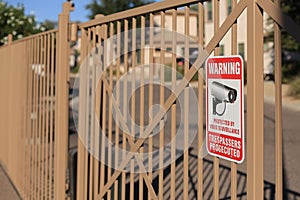 Warning Sign at Residential Housing Community Entrance Gate