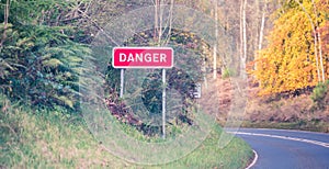 Warning sign on the road - danger on the rural road