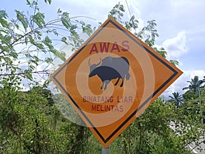 Warning sign on the road in malaysia. This sign is used to warn drivers of dangerous animals.