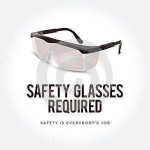 Warning sign - Safety glasses required. Plastic safety glasses.