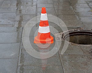 Warning sign and sewerage hole