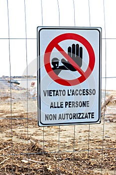 Warning sign on the shoreline in Follonica, Italy