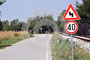 Warning sign that shows bent arrow that warns drivers on approaching  double bent on road