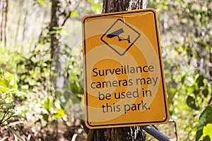 Warning sign about surveillance cameras in the park